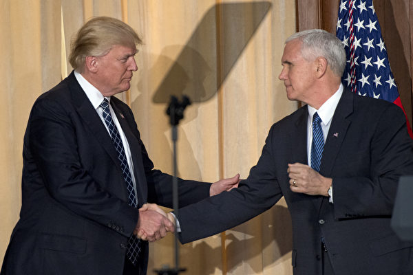 WASHINGTON, DC - MARCH 28:  US President Donald Trump, left, shakes hands with US Vice President Mike Pence, right, prior to signing an Energy Independence Executive Order at the Environmental Protection Agency (EPA) Headquarters on March 28, 2017 in Washington, DC. The order reverses the Obama-era climate change policies.  (Photo by Ron Sach-Pool/Getty Images)