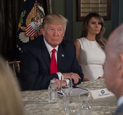 US President Donald Trump listens before a meeting with administration officials and First Lady Melania Trump (R) on the opioid addiction crisis at the Trump National Golf Club in Bedminster, New Jersey, on August 8, 2017. / AFP PHOTO / NICHOLAS KAMM        (Photo credit should read NICHOLAS KAMM/AFP/Getty Images)