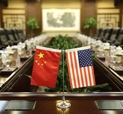 epa06057110 US and Chinese national flags are placed on a table for a meeting between Secretary of Agriculture Sonny Perdue and China's Minister of Agriculture Han Changfu at the Ministry of Agriculture in Beijing, China, 30 June 2017.  EPA/JASON LEE / POOL