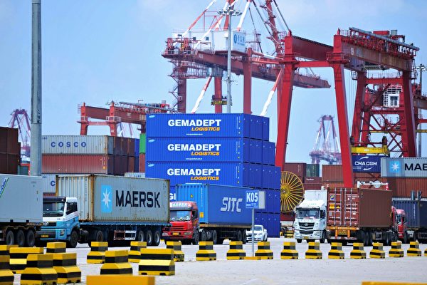 Containers are transferred at a port in Qingdao in China's eastern Shandong province on July 6, 2018. - Punishing US tariffs on Chinese imports took effect on July 6, the first shot in what Beijing called "the largest trade war in economic history" between the world's top two economies. (Photo by - / AFP) / China OUT        (Photo credit should read -/AFP/Getty Images)