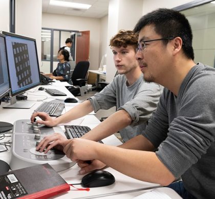 Nianshuang Wang, research associate, right, and Daniel Wrapp, graduate student, left, review cryo-EM images in the The Sauer Structural Biology Laboratory Monday Feb. 17, 2020 at The University of Texas at Austin.