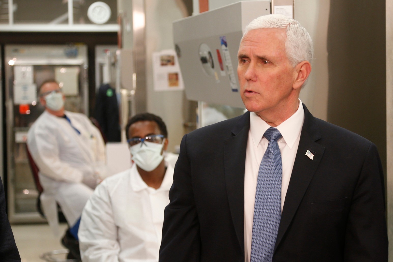 Vice President Mike Pence visits the molecular testing lab at Mayo Clinic Tuesday, April 28, 2020, in Rochester, Minn., where he toured the facilities supporting COVID-19 research and treatment. Pence chose not to wear a face mask while touring the Mayo Clinic in Minnesota. It's an apparent violation of the world-renowned medical center's policy requiring them. (AP Photo/Jim Mone)