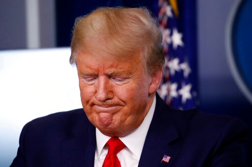 President Donald Trump pauses during a briefing about the coronavirus in the James Brady Press Briefing Room of the White House, Tuesday, March 31, 2020, in Washington. (AP Photo/Alex Brandon)