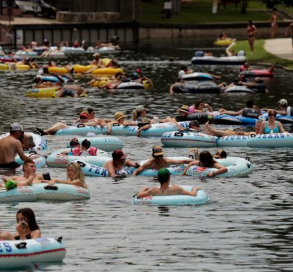 Tubers float the Comal River despite the recent spike in COVID-19 cases, Thursday, June 25, 2020, in New Braunfels, Texas. Texas Gov. Greg Abbott said Wednesday that the state is facing a "massive outbreak" in the coronavirus pandemic and that some new local restrictions may be needed to protect hospital space for new patients. (AP Photo/Eric Gay)