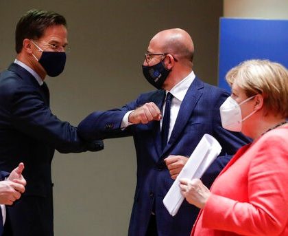 Dutch Prime Minister Mark Rutte, center left, elbow bumps with European Council President Charles Michel, center right, as German Chancellor Angela Merkel, right, walks by during a round table meeting at an EU summit in Brussels, Tuesday, July 21, 2020. Weary European Union leaders are expressing cautious optimism that a deal is in sight as they moved into their fifth day of wrangling over an unprecedented budget and coronavirus recovery fund. (Stephanie Lecocq, Pool Photo via AP)