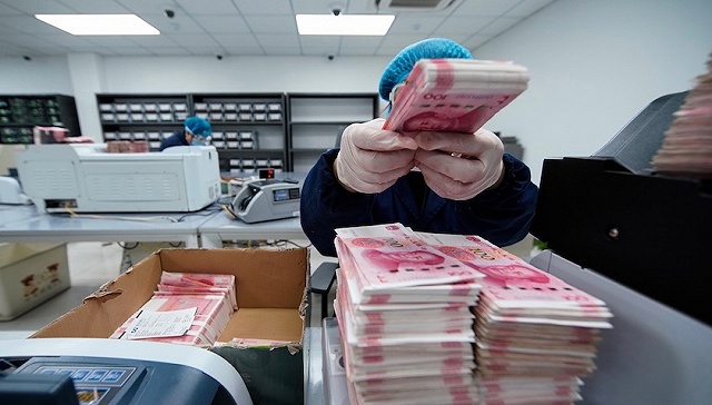 中国央行报告：更多外贸企业选择人民币进行跨境收付