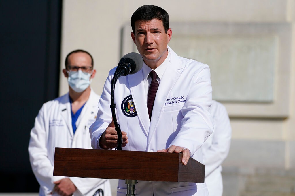 Dr. Sean Conley, physician to President Donald Trump, talks with reporters at Walter Reed National Military Medical Center, Monday, Oct. 5, 2020, in Bethesda, Md. (AP Photo/Evan Vucci)