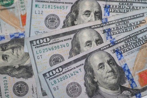 The likeness of Benjamin Franklin shown from $100 bills in Dallas, Wednesday, Jan. 22, 2020. (AP Photo/LM Otero)