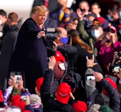 Supporters cheer as President Donald Trump departs following a campaign rally at Erie International Airport, Tom Ridge Field in Erie, Pa, Tuesday, Oct. 20, 2020. (AP Photo/Gene J. Puskar)