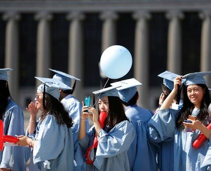 Graduates find their seats during the Columbia University graduation ceremony in New York, Wednesday, May 17, 2017. Over 14,000 students graduated during the ceremonies. (AP Photo/Seth Wenig)