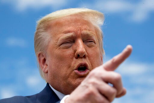 President Donald Trump speaks with reporters before boarding Air Force One as he departs Saturday, May 30, 2020, at Andrews Air Force Base, Md. Trump is en route to Kennedy Space Center for the SpaceX Falcon 9 Launch. (AP Photo/Alex Brandon)