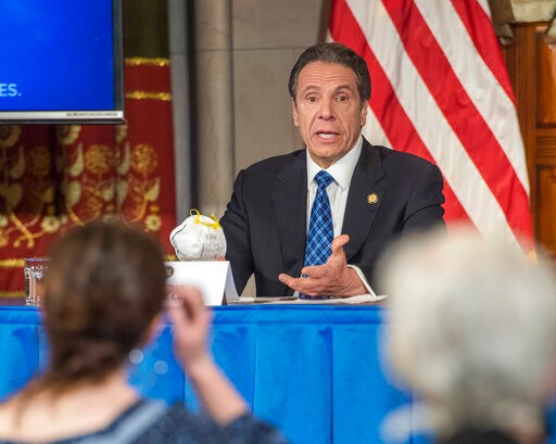 In this April 24, 2020 photo provided by the Office of Governor Andrew M. Cuomo, Gov. Cuomo addresses the media while holding an n95 mask during his daily press briefing on COVID-19, Coronavirus, at the State Capitol in Albany, N.Y. The mask was sent to the governor by a retired farmer from Kansas whose wife only has one lung. (Darren McGee/Office of Governor Andrew M. Cuomo via AP)