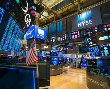 FILE - This photo provided by the New York Stock Exchange shows the unoccupied NYSE trading floor, closed temporarily for the first time in 228 years as a result of coronavirus concerns, Tuesday March 24, 2020. Global stocks and U.S. futures declined Thursday after the U.S. Senate approved a proposed $2.2 trillion virus aid package following a delay over its details and sent the measure to the House of Representatives. (Kearney Ferguson/NYSE via AP, File)