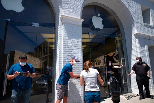 The Apple store is open for the first day since the start of the shutdown during the coronavirus pandemic, Wednesday, June 17, 2020, in Greenwich, Conn. The state began Phase 2 of reopening Wednesday. (AP Photo/Mark Lennihan)