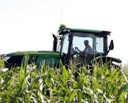 Farmer Tim Novotny of Wahoo, shreds male corn plants in a field of seed corn, in Wahoo, Neb., Tuesday, July 24, 2018. The Trump administration announced Tuesday it will provide $12 billion in emergency relief to ease the pain of American farmers slammed by President Donald Trump's escalating trade disputes with China and other countries. (AP Photo/Nati Harnik)