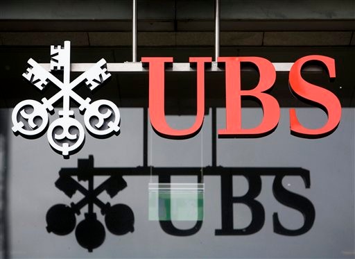 FILE - In this Feb. 12, 2009 file photo, the logo of the Swiss bank UBS, is seen in Aarau, Switzerland. The U.S. government and Swiss banking giant UBS AG have reached a long-awaited agreement in a case over secret Swiss bank accounts for alleged American tax evaders, lawyers for both sides told a federal judge Wednesday, Aug. 12, 2009. (AP Photo/Keystone, Alessandro Della Bella, File)