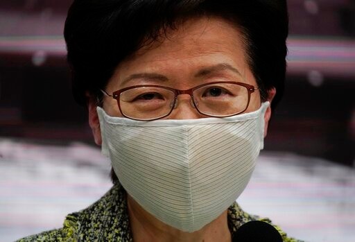 Hong Kong Chief Executive Carrie Lam listens to questions from reporters during a press conference in Hong Kong, Friday, Aug. 7, 2020. The semi-autonomous city of Hong Kong reports 95 new cases and three additional fatalities reported. The city of 7.5 million people has restricted indoor dining and require faces masks to be worn in all public places. (AP Photo/Vincent Yu)