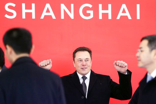 In this photo taken Monday, Jan. 7, 2019, and released by Xinhua News Agency, Tesla CEO Elon Musk attends the groundbreaking ceremony of the Tesla Shanghai factory in Shanghai, China. Musk said Monday on Twitter that the automaker is breaking ground for a Shanghai factory and will start production of its Model 3 by the end of the year. (Ding Ting/Xinhua via AP)