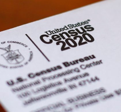 FILE - This Sunday, April 5, 2020, photo shows an envelope containing a 2020 census letter mailed to a U.S. resident in Detroit.  The U.S. Census Bureau has spent much of the past year defending itself against allegations that its duties have been overtaken by politics. With a failed attempt by the Trump administration to add a citizenship question, the hiring of three political appointees with limited experience to top positions, a sped-up schedule and a directive from President Donald Trump to exclude undocumented residents from the process of redrawing congressional districts, the 2020 census has descended into a high-stakes partisan battle.  (AP Photo/Paul Sancya, File)