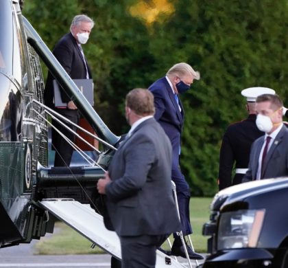 President Donald Trump arrives at Walter Reed National Military Medical Center, in Bethesda, Md., Friday, Oct. 2, 2020, on Marine One helicopter after he tested positive for COVID-19. White House chief of staff Mark Meadows is at left. (AP Photo/Jacquelyn Martin)