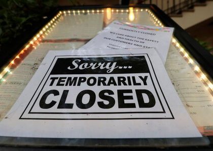 A closed sign is posted at a restaurant along the River Walk in San Antonio, Tuesday, April 28, 2020. Texas Gov. Greg Abbott is allowing Texas' stay-at-home orders to expire this week and easing restrictions on non-essential business and restaurants can open for seating with 25 percent capacity. (AP Photo/Eric Gay)